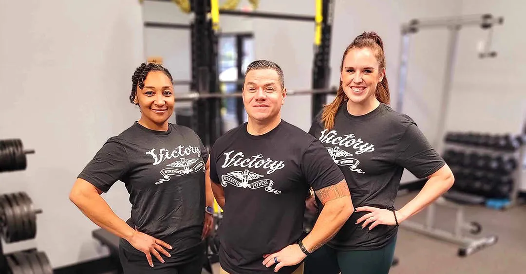 Three Victory Strength & Fitness coaches at the gym